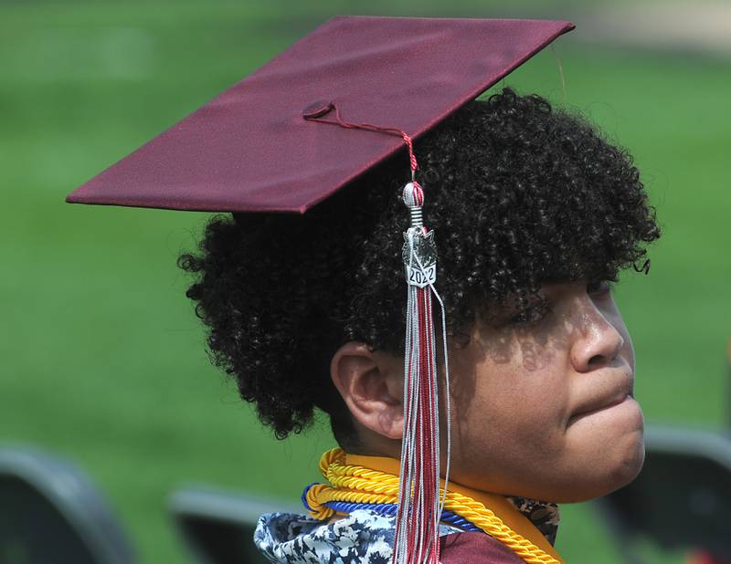 Jonah Zhungu waits his turn to receive his diploma Saturday, May 14, 2022, during the graduation ceremony at Prairie Ridge High School.