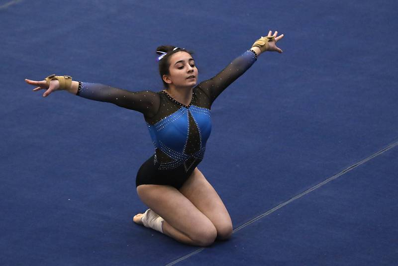 Downers Grove South’s Genevieve Helon competes in the preliminary round of the floor exercise Friday, Feb. 17, 2023, during the IHSA Girls State Final Gymnastics Meet at Palatine High School.