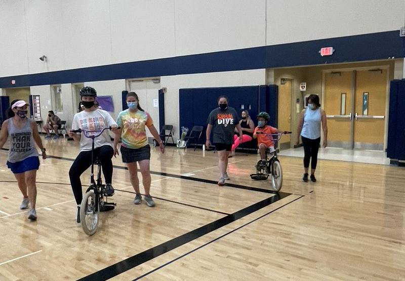 The iCan Bike program, which teaches people with disabilities ages 8 and up to ride a conventional two-wheel bike, was held June 14 to June 18 at Spencer Crossing School in New Lenox. Attendees were scheduled for one 75-minute session each day, Monday through Friday.