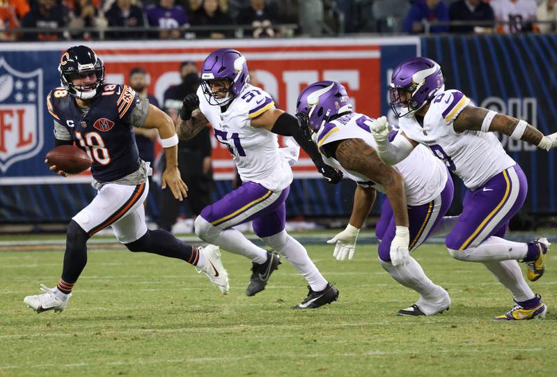Chicago Bears quarterback Caleb Williams scrambles away from the Minnesota Vikings pass rush during their game Monday, Sept. 8, 2025, at Soldier Field in Chicago.