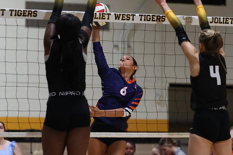 Romeoville’s Lianna Ortiz stretches for the shot against Joliet West on Thursday, Sept. 5, 2024 in Joliet.