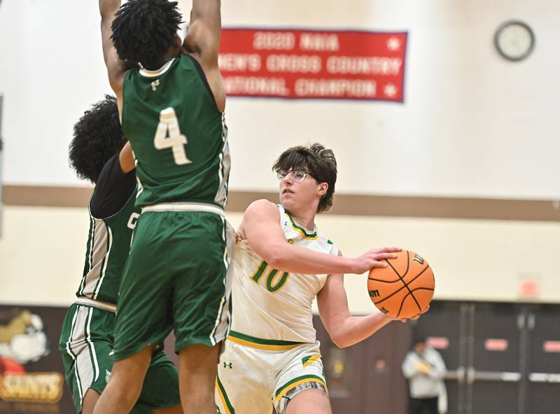 Providence Catholic's Cade Styrsky (10) looks to pass the ball during the WJOL tournament game against Plainfield Central on Friday, NOV. 28, 2025, at Joliet.