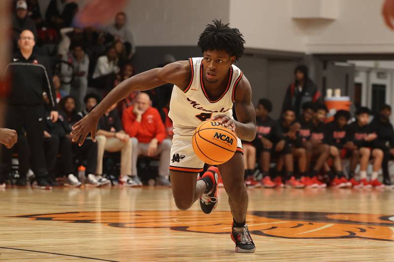 Minooka’s Jeremiah Brown makes a move against Bolingbrook on Tuesday, Dec. 17, 2024 in Minooka.