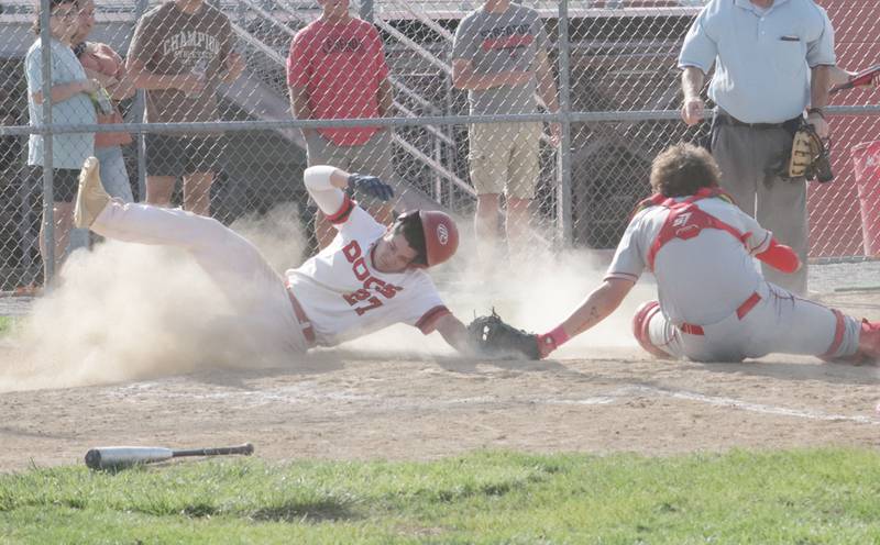 Streator's Parker Phillis is tagged out while sliding into home plate by Ottawa catcher Packston Miller on Tuesday, May 16, 2023 at Streator High School.