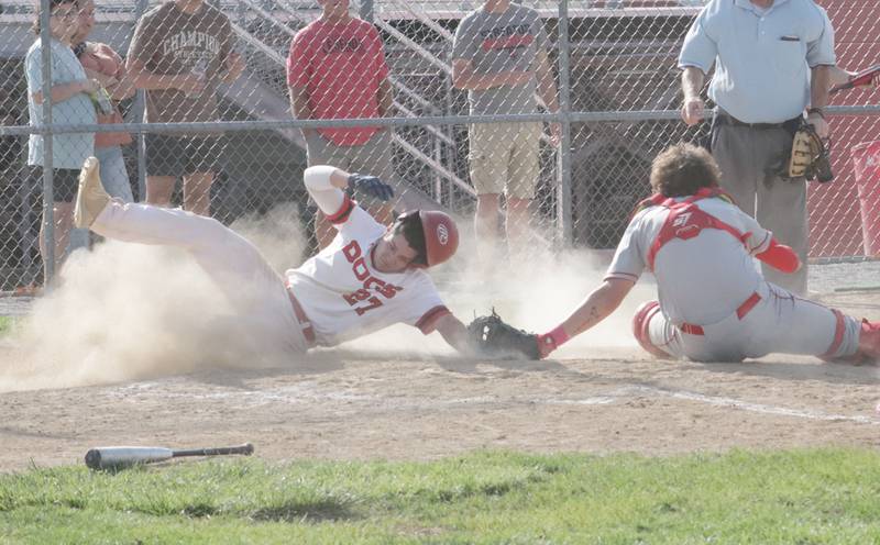 Streator's Parker Phillis is tagged out while sliding into home plate by Ottawa catcher Packston Miller on Tuesday, May 16, 2023 at Streator High School.