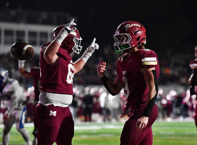Morris' Caeden Curran (9) scores a touchdown during the class 4A first round playoff game against Woodstock on Friday, OCT. 31, 2025, at Morris.