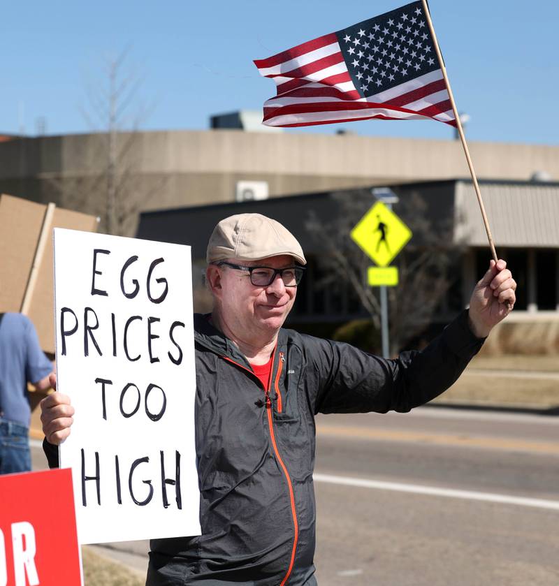 Gary Bellert, from Sycamore, takes part in a protest Friday, March 14, 2025, on the corner of State and Main Street in Sycamore, to voice his displeasure with President Donald Trump. The group was protesting recent cuts by the Trump administration to the Department of Veterans Affairs.