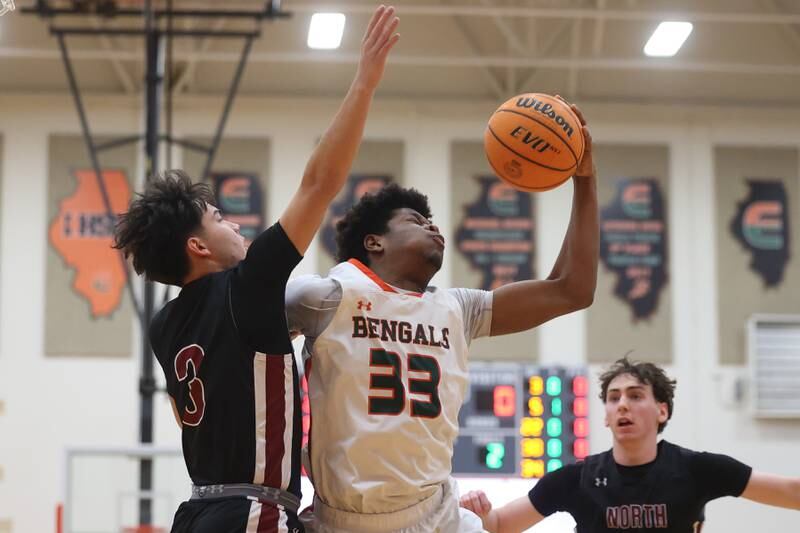 Plainfield East’s Leslie Nii Apa Pobee grabs a rebound against Plainfield North on Tuesday, Jan 14, 2025.