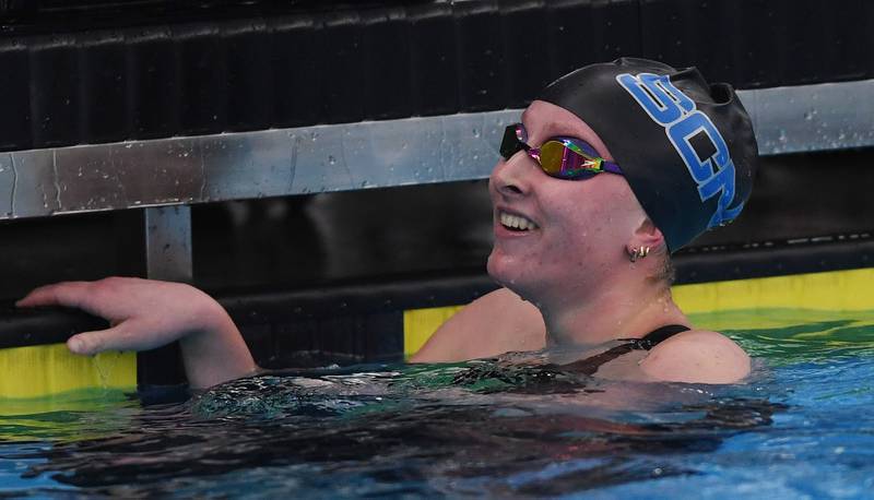 St. Charles North’s Lucia Negro reacts to her sixth-place finish in the 200-yard freestyle, which qualifies her for a spot in the finals, during the girls state swimming preliminaries at the FMC Natatorium on Friday, Nov. 14, 2025 in Westmont.