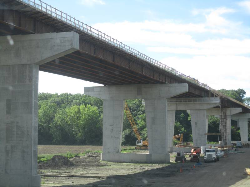 The Eldamain Road bridge dwarfs construction equipment below. The Fox River crossing is only the eighth in Kendall County history and the first since the Orchard Road bridge opened in 2001. (Mark Foster -- mfoster@shawmedia.com)