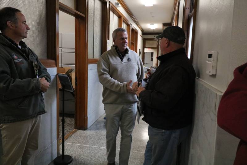 DeKalb mayoral candidate Cohen Barnes greets people standing in line as they prepare to file nomination papers Nov. 12, 2024, at DeKalb City Hall.