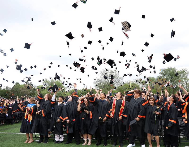 Caps fly as members of the Class of 2025 graduate from McHenry High School during their commencement ceremony on Saturday, May 17, 2025, at McCracken Field in McHenry.