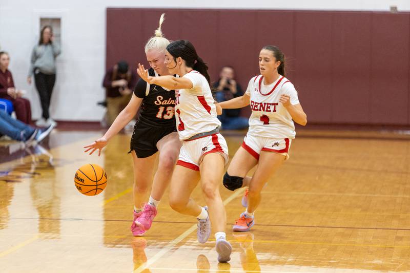 St. Charles East's Addie Schilb is pressured by Benet's Hadley Engler at the Montini Christmas Tournament on Tuesday, Dec.23,2025 in Lombard.