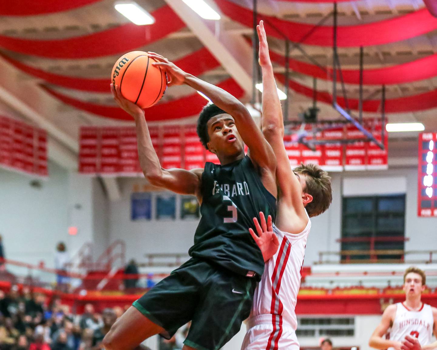 Glenbard West's TJ Williams (3) puts up a shot during their basketball game between Glenbard West at Hinsdale Central, Friday  Dec 6, 2024  in Hinsdale.