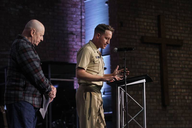 Gene Potoczek, of Fox Lake, U.S. Army Veteran, stands next to Christopher Matthews, U.S. Navy Commander, of Ingleside, as they unite in prayer for the military and veterans Thursday, May 4, 2023, during the Grant Township National Day of Prayer Gathering at CrossPoint Church in Ingleside.