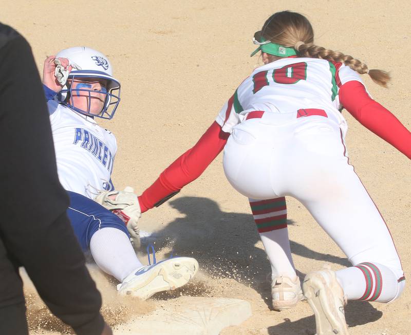 Princeton's Avah Oertel slides in safe to third base as L-P's Kelsey Frederick applies the tag on Tuesday, March 19, 2024 in Princeton.