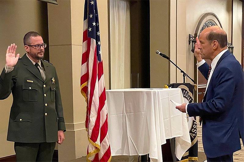 Forest Preserve District of DuPage County Chief of Police David Pederson takes his oath of office, administered by DuPage County State's Attorney Bob Berlin.