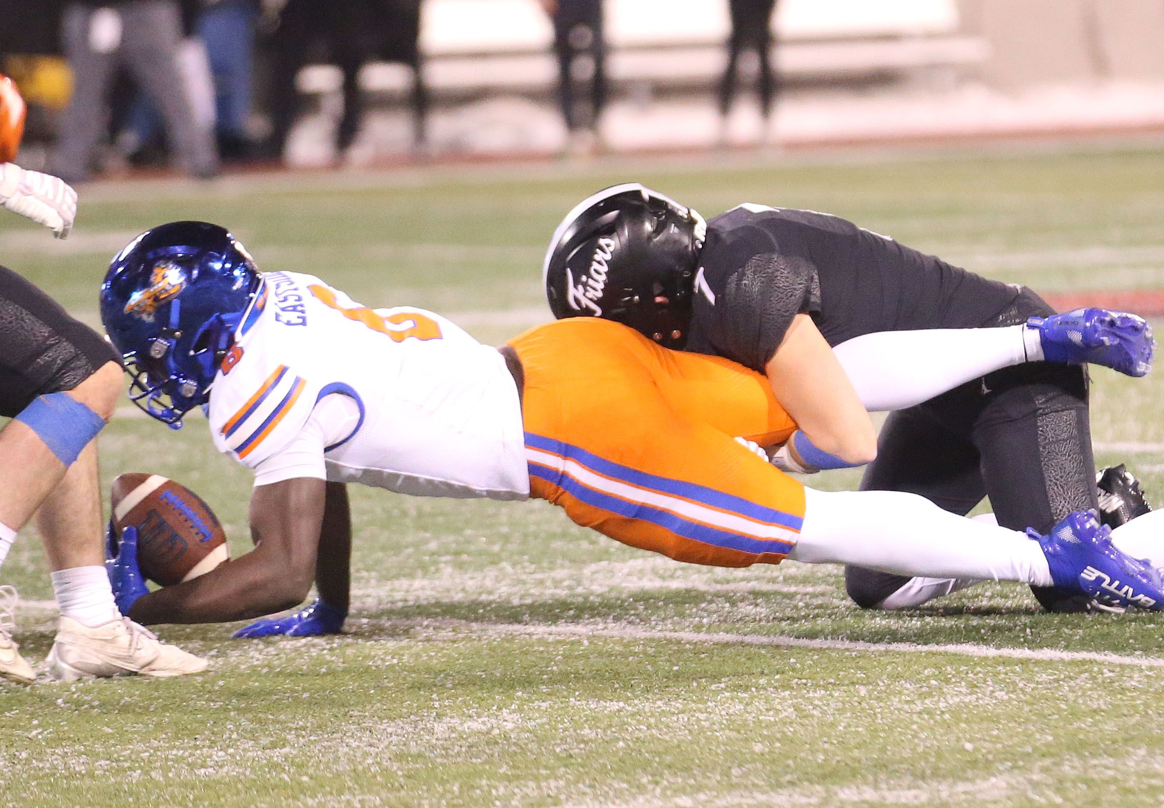 Fenwick's Tommy Thies sacks East St. Louis's Myson Johnson-Cook during the Class 6A State championship game on Tuesday, Dec. 2, 2025 in Hancock Stadium at Illinois State University in Normal. 