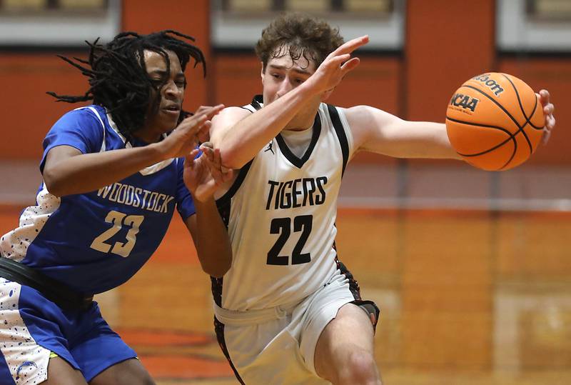 Crystal Lake Central's Logan Laudadio (right) drives to the basket against Woodstock's Marc Thomas during a nonconference boys basketball game on Monday Jan. 5,  2026, at Crystal Lake Central School.