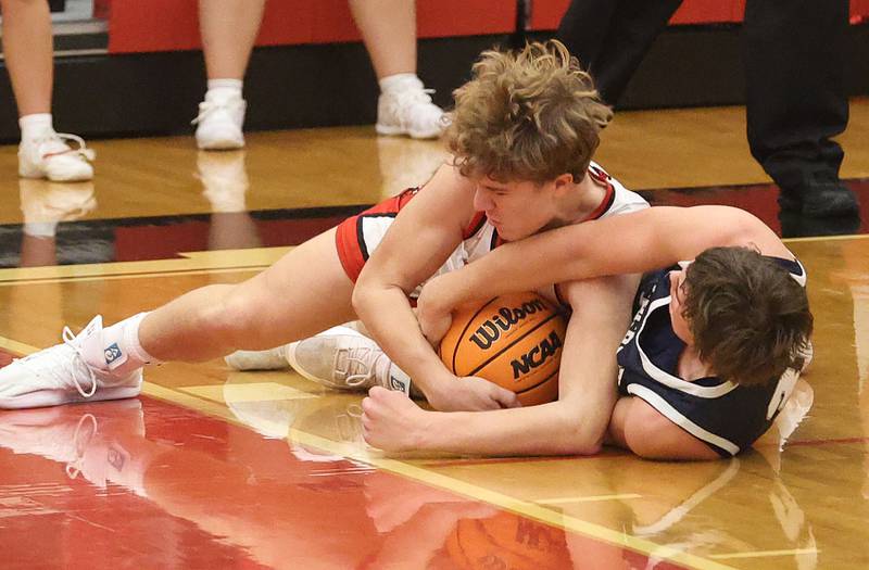 Hall's Chace Sterling and Fieldcrest's Drew Overocker gets tangled up for a loose ball during the Colmone Classic on Friday, Dec. 12, 2025 at Hall High School.