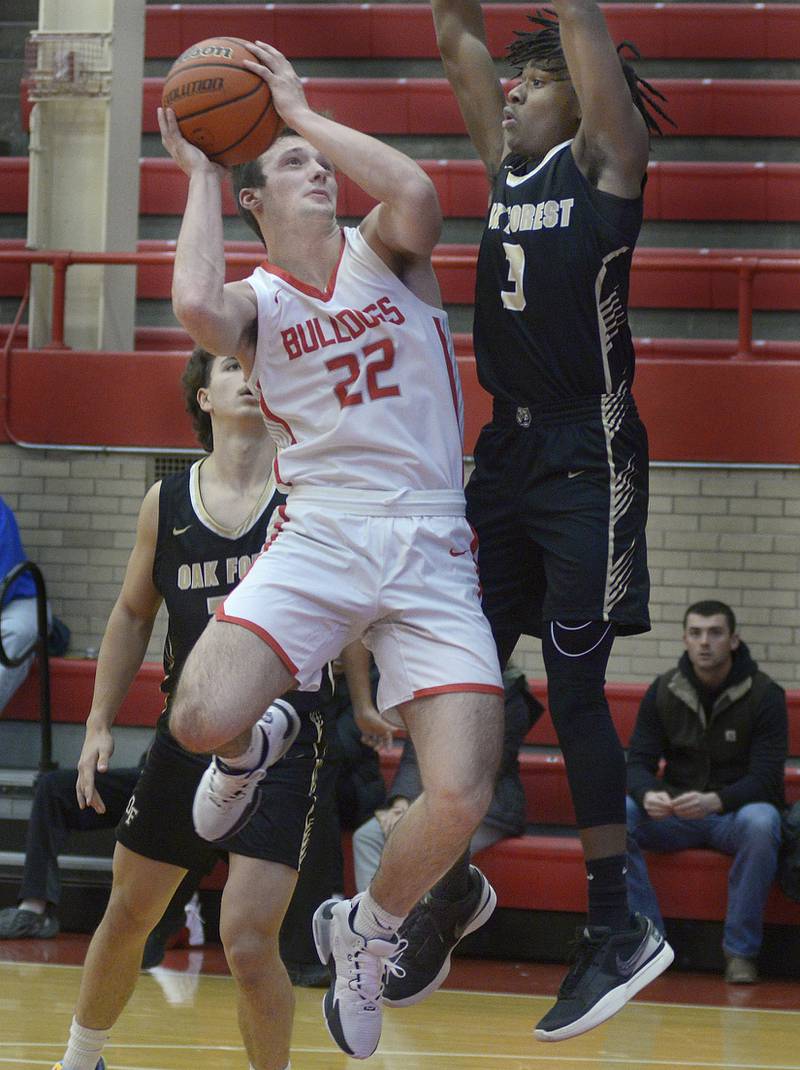 Streator’s Christian Benning tries to go up and around Oak Forest’s Deshawn Nolan for a shot during the 1st  period Friday during the Dean Riley Shootin’ The Rock Thanksgiving Tournament at Ottawa.