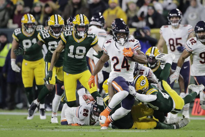 Chicago Bears running back Khalil Herbert is stopped by Green Bay Packers cornerback Kevin King, Sunday, Dec. 12, 2021, in Green Bay, Wis.