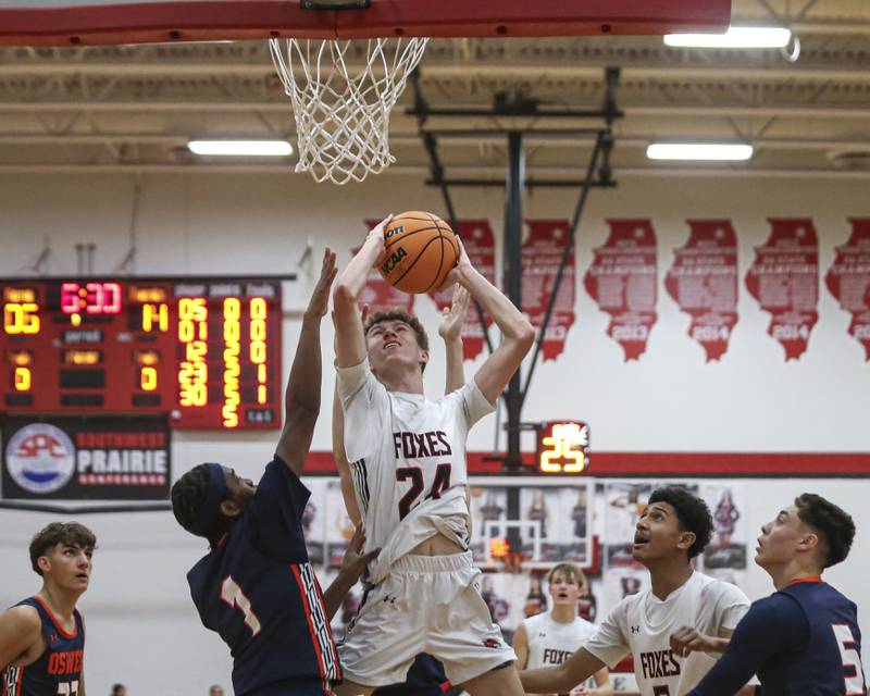 Yorkville's Nathan Kubin (24) puts up a shot underneath the basket during their basketball game between Oswego at Yorkville Friday, Dec 12, 2025 in Yorkville.