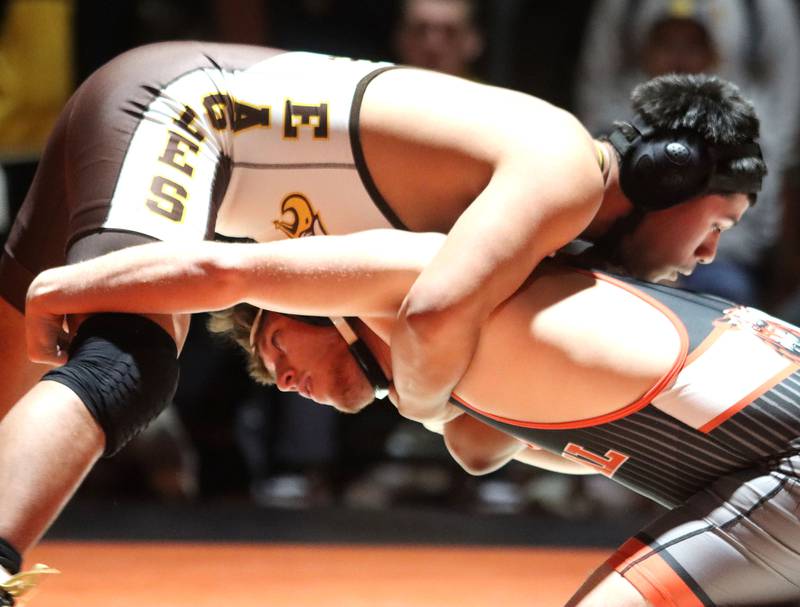 Crystal Lake Central’s Luke Hartman, bottom,  battles Jacobs’ Brian Ayala at 190 pounds in varsity boys wrestling on Tuesday, Jan. 20, 2026 at Crystal Lake Central High School in Crystal Lake.