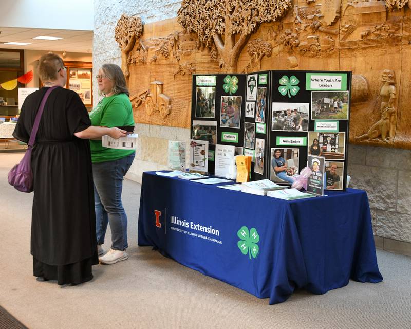 Nicole Groezinger, right, 4-H program coordinator for the University of Illinois Extension in DeKalb County talks with Kirstie Glickstein on Sunday Oct. 12, 2025,  during the DeKalb County 4-H carnival held at the DeKalb County Farm Bureau in Sycamore.