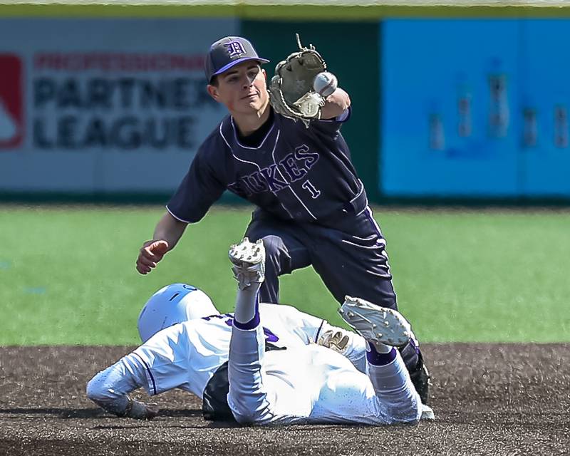 Dixon's Alex Harrison (1) takes a throw at second during baseball game between Dixon at Hampshire.  March 28, 2024