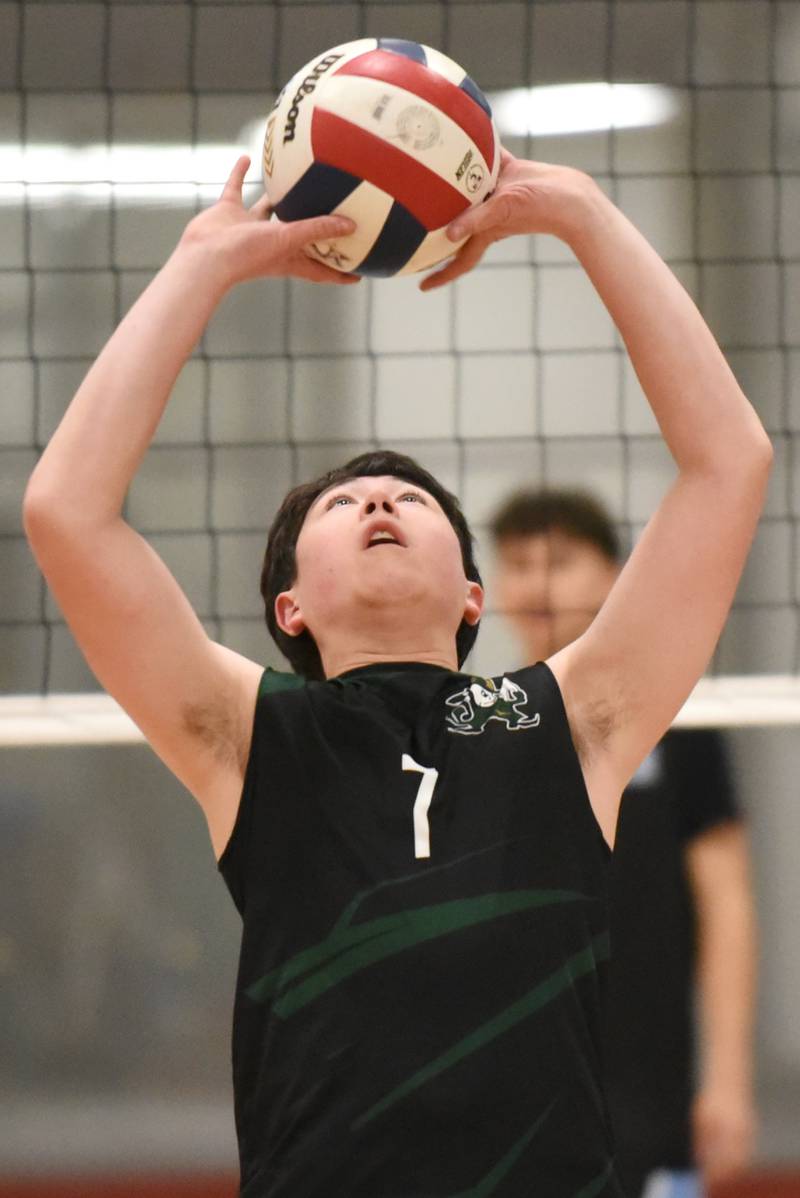 Bishop McNamara's Kaiden Hunt sets the ball during a game at Kankakee Tuesday, March 31, 2026.