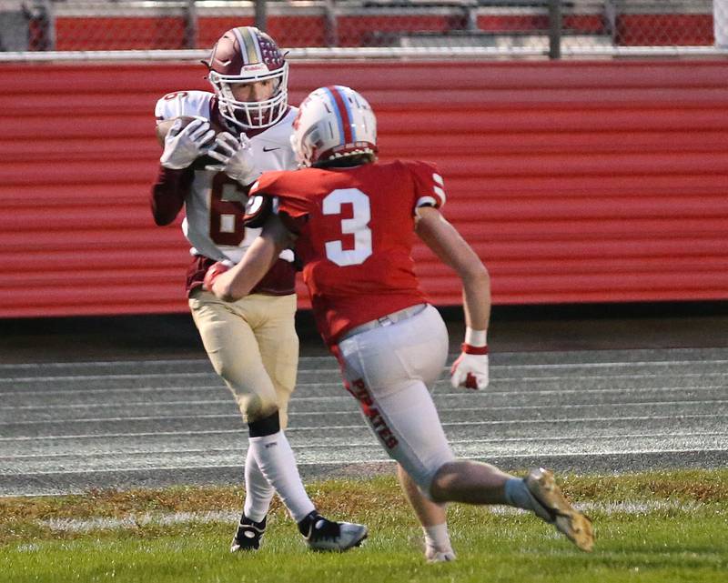 Morris's Charlie Wright makes a catch over Ottawa's Hayden Swett on Friday, Oct. 13, 2023 at King Field.