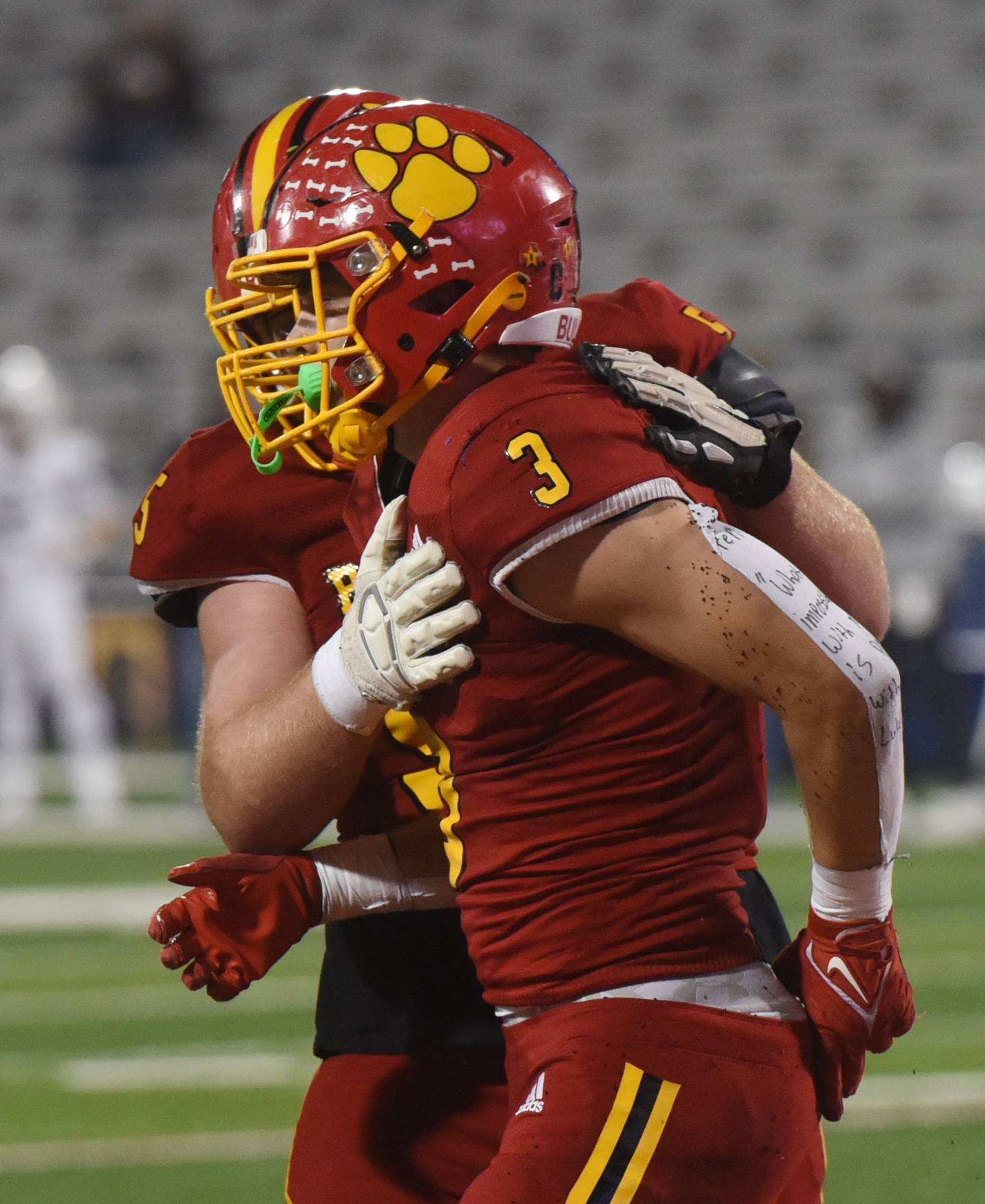 Joe Lewnard/jlewnard@dailyherald.com
Batavia's Ryan Whitwell, right, gets a pat on the chest from teammate Jimmy Zitkus after scoring a second-quarter touchdown during the Class 7A football state title game at Memorial Stadium in Champaign on Saturday, Nov. 26, 2022.