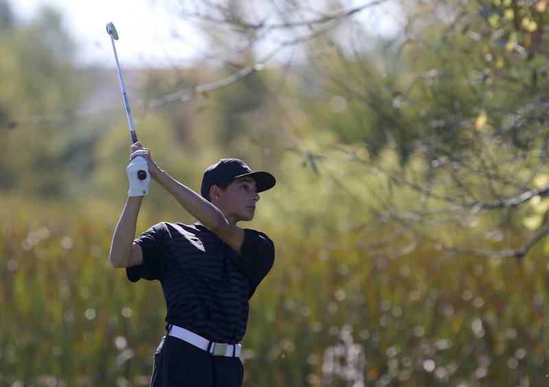 Huntley’s Austin Matich watches his tee shot on the sixth hole during the IHSA Class 3A Dundee-Crown Regional golf tournament on Wednesday, Oct. 2, 2024 at Randall Oaks Golf Club in West Dundee.