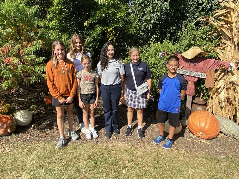 Winners of the 2025 Sycamore Kiwanis Club’s Junior Marshal Essay Contest for Sycamore Pumpkin Fest pose for a photo at Johnson's Pumpkin Patch off Illinois Route 64 on Friday, Oct. 3, 2025. (From left): Aida Doty, 13; Evelyn Hall, 13; Quinn Oncken, 11; Annabelle Vega, 13; Amelia Ballerini, 12; and David Orellana, 11.