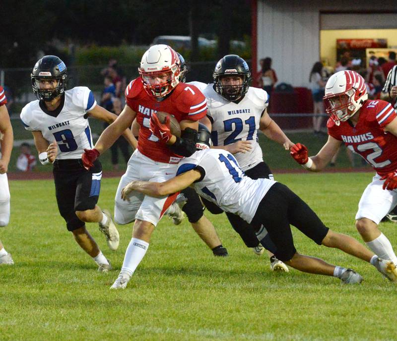 Eastland-Pearl City's Jaidyn McKinney (11) zeroes in on Oregon's Logan Weems (7) during a scrimmage at Landers-Loomis Field in Oregon on Friday, Aug. 23. 2024. The regular season begins Aug. 30 for area high school teams.
