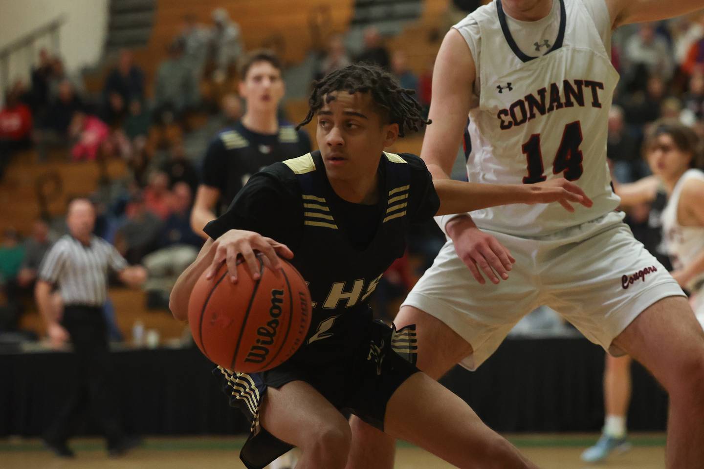 Lemont’s Ryan Runaas looks for a play against Conant in the Jack Tosh Holiday Classic at York High School on December 27th.