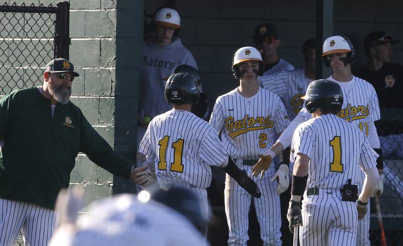 Crystal Lake South’s Christin Alther is congregated after scoring a run during a Fox Valley Conference baseball game against Prairie Ridge on Monday, April 8, 2024, at Crystal Lake South High School.