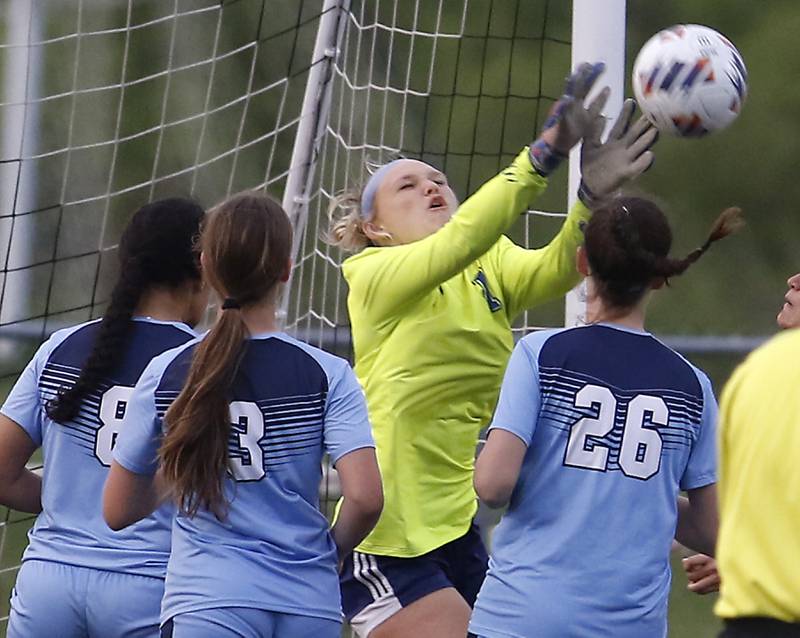 Johnsburg's Sophie Person makes a save surrounded by Willows players during a IHSA Division 1 Richmond-Burton Sectional semifinal soccer match Tuesday, May 16, 2023, at Richmond-Burton High School.