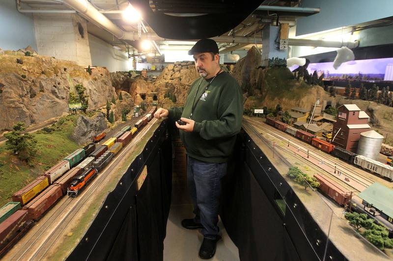 Trent Blasco, of Wauconda controls his steam locomotive on the tracks at the Lake County Model Railroad Club in Wauconda. The club is celebrating their 50 anniversary.