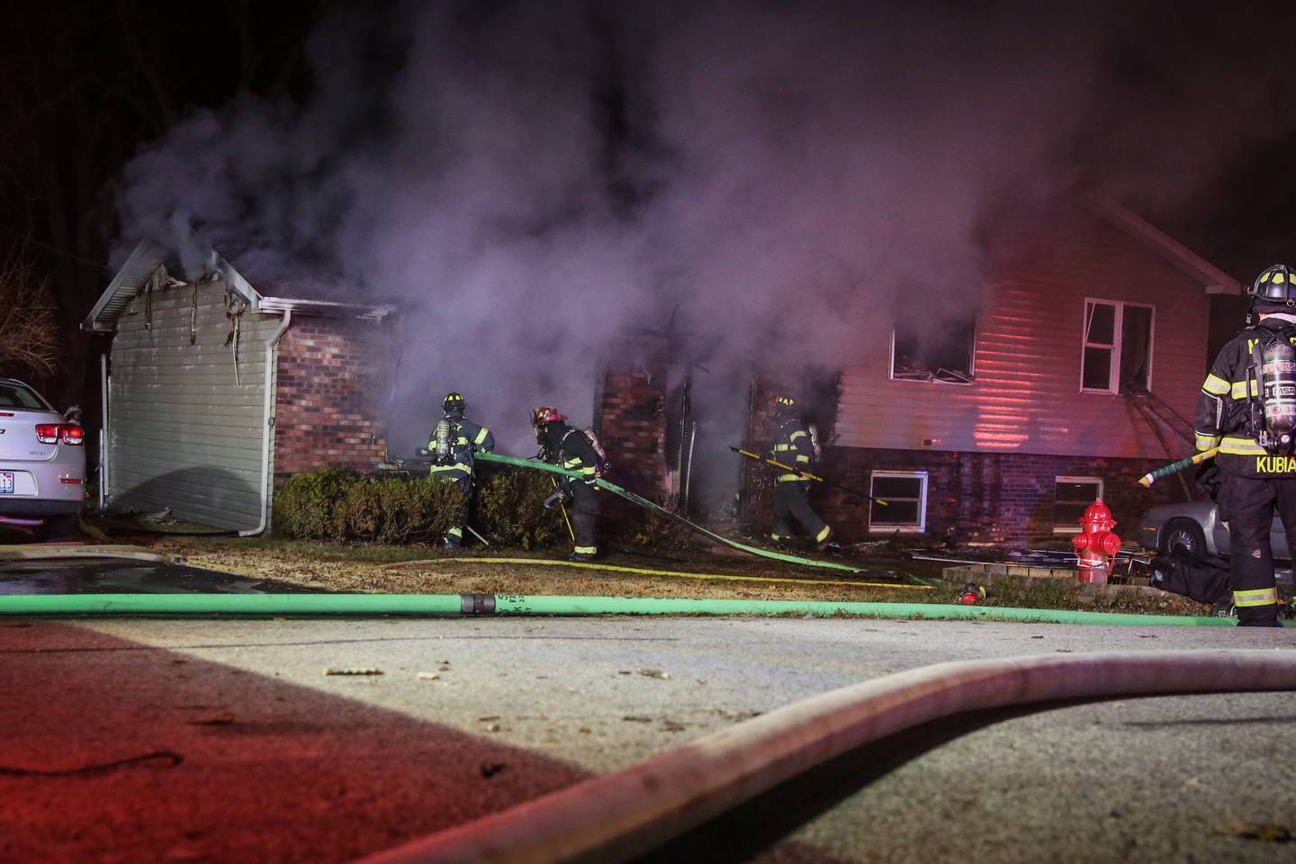 Firefighters from the McHenry Township Fire Protection District respond to a house fire Saturday, Dec. 11, 2021, in the 500 block of Sunrise Drive in unincorporated McHenry County near Johnsburg.