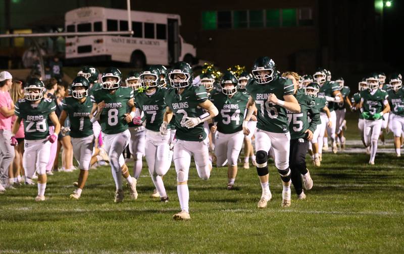 Members of the St. Bede football team take the field on Friday, Oct. 17, 2025 at St. Bede Academy.