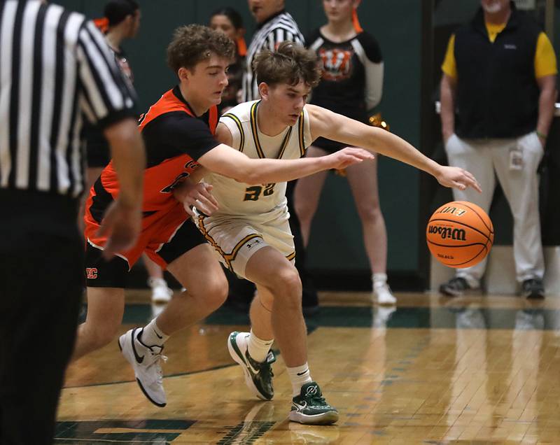 Crystal Lake Central's Logan Laudadio tries to steal the ball from Crystal Lake South's Nick Stowasser during an IHSA Class 3A Crystal Lake South Regional boys basketball semifinal game on Wednesday, February, 25, 2026, at Crystal Lake South High School.