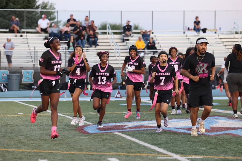 Kankakee players smile as they leave the field after securing a 40-26 victory over Plainfield South on Monday, Oct. 6, 2025, to advance in the IHSA Kankakee Regional bracket.