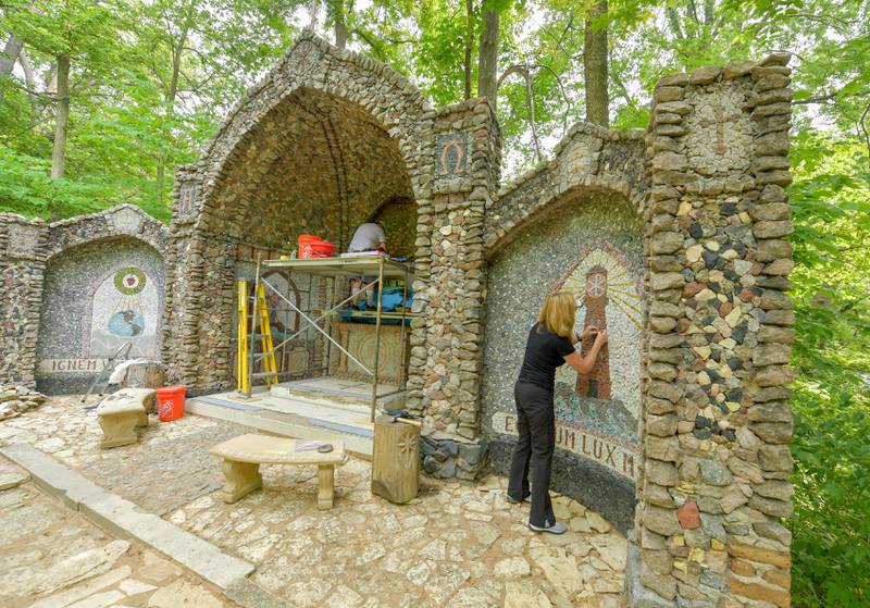 Volunteer Chris Alimenti works on the restoration of the Geneva Grotto on Thursday, June 15, 2023.