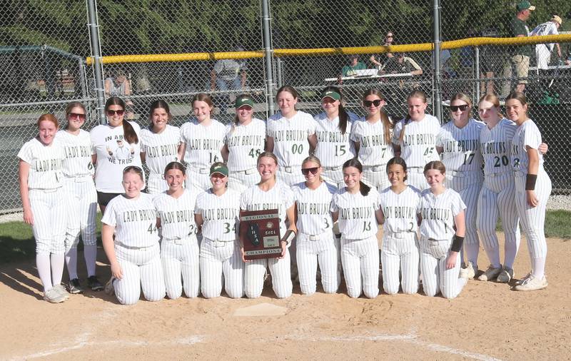 Members of the St. Bede girls softball team pose with the Class 2A Regional plaque after defeating Midwest Central on Friday, May 17, 2024 at at Abbot Phillip Davy Field.