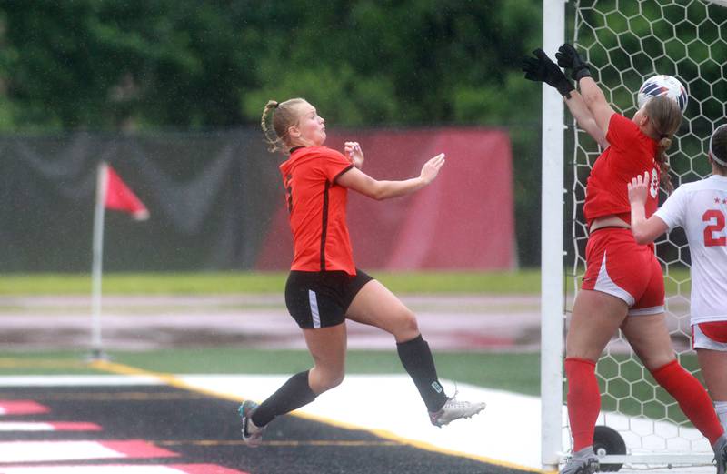 Crystal Lake Central’s Paiton Hulata (left) scores the only goal against Triad during the Class 2A state championship game at North Central College in Naperville on Saturday, June 1, 2024.