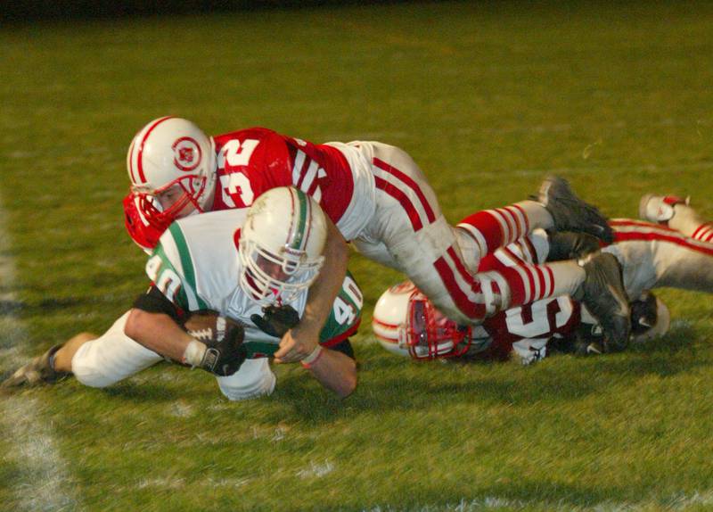 La Salle-Peru's Eric Veselsky (40) is tackled near the sideline in the 2002 game with Ottawa at King Field.