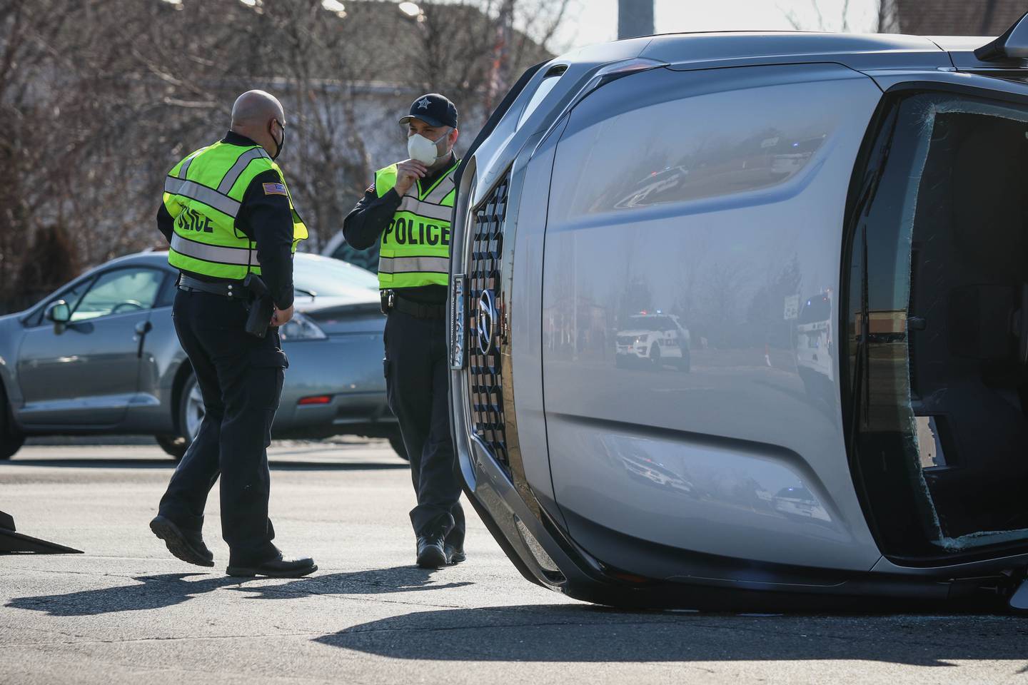 Huntley Fire Protection District firefighters extricated a woman from an SUV after it flipped onto its side in a two-vehicle crash at the intersection of Algonquin and Lakewood roads on Monday afternoon.