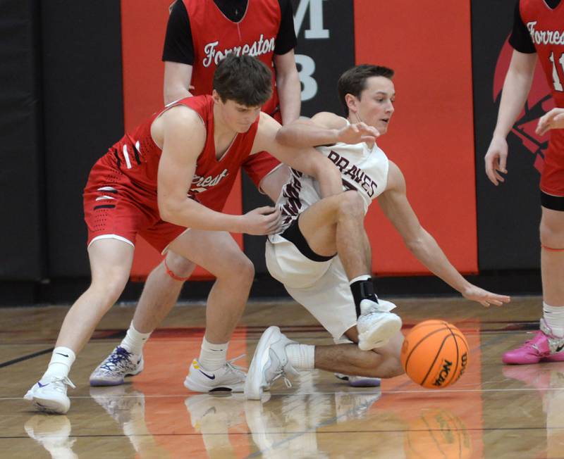 Annawan's Maddux Heitzler (3) and Forreston's Darin Greenfield (12) battle for a loose ball during the championship of the 1A Amboy Regional on Friday, Feb. 28, 2025 at Amboy High School.